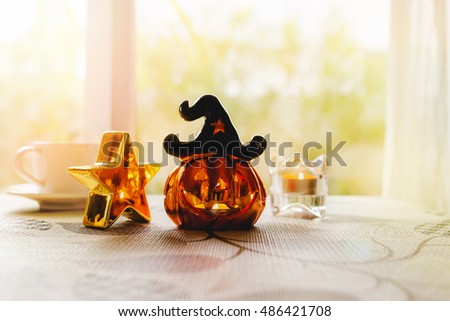 Halloween pumpkin Jack-o'-lantern on dining table