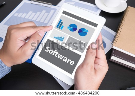 Software Data Digital Programs System Technology computer Modern people doing business, graphs and charts being demonstrated on the screen of a touch-pad,blank screen copy space