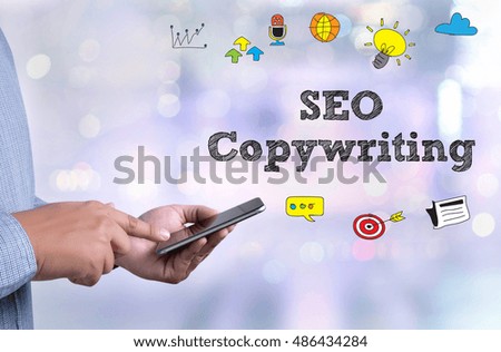 SEO Copywriting  person holding a smartphone on blurred cityscape background