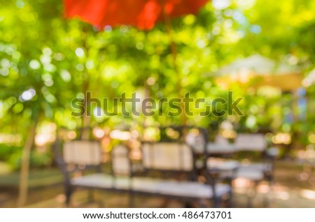image of Abstract blurred outdoor coffee hut on day time in garden for background usage .