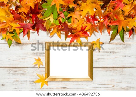 Autumn leaves and golden frame with space for your picture or text