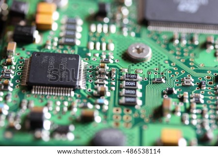 Closeup of a printed circuit board with components such as integrated circuits 