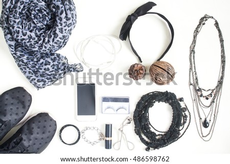 Preparation for travel,trip vacation, tourism mock up of cell phone,camera,scarf,sneaker shoes and beauty items on white background. Flat lay, top view