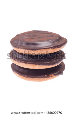 Three cookies with chocolate on the surface on white background isolated. Vertical picture.