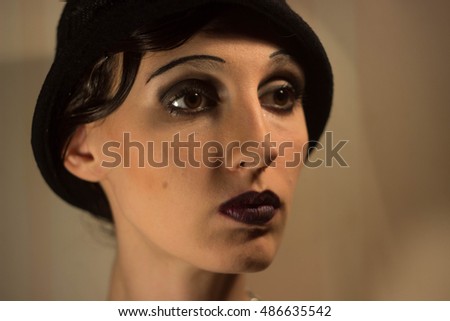 An imitation of the famous Actresses of the silent era of old Hollywood portrait girl makeup luxury movie star