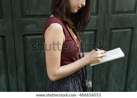 Woman Making Notes Outside City Concept