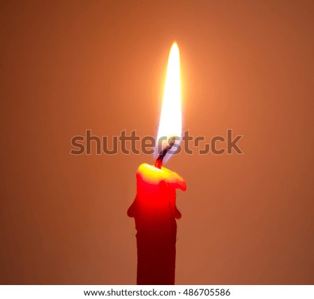 One light candle burning brightly in night