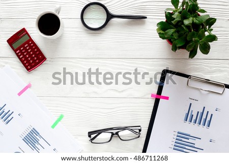 workplace economist on white office table with space for text