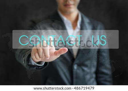Business word Business man point CONTACT US on white tab virtual screen in dark background.