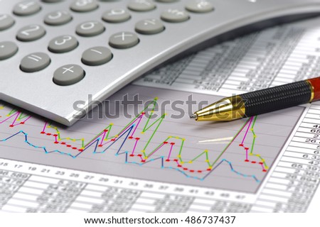finance and calculation at stock market with chart and spreadsheet