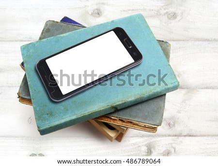 books and smartphone with clipping path screen