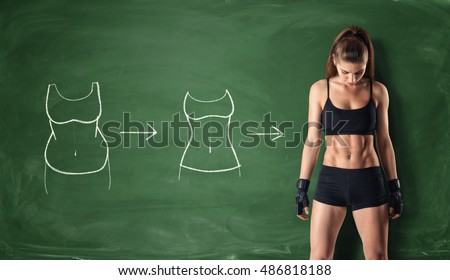 Concept of how a girl's body changing - from fat belly to perfect waist and abs on the background of a chalkboard. Self-improvement and sport. Athletic body. Workout and fitness. Royalty-Free Stock Photo #486818188