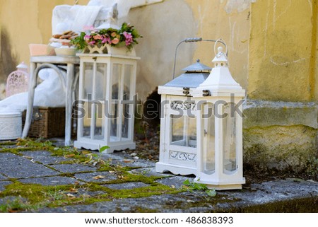nice vintage white decoration on chair and lantern