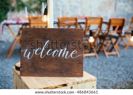 Wedding and party place decoration with wooden welcome sign