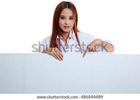 Young Asian female doctor point down to blank sign on white background.