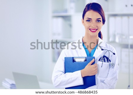 Medical team sitting at the table in modern hospital