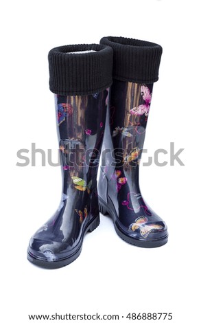 Warm black female rubber boots isolated on white background with clipping path