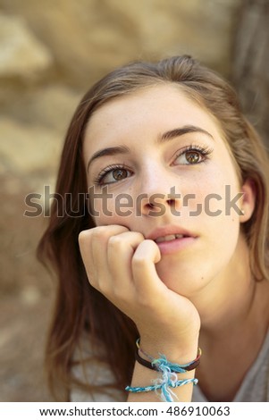 Portrait of teenage girl with natural light and background blur