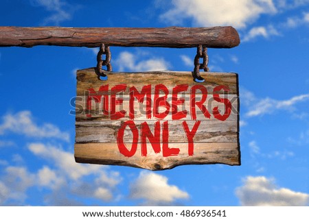 Members only motivational phrase sign on old wood with blurred background