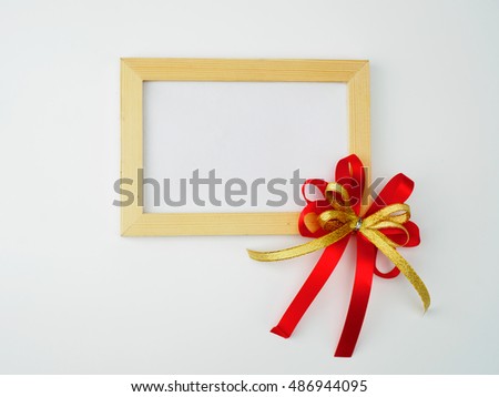 vintage style.white frame emtry and red ribbon on background. christ mas and new year for written message.