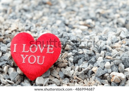 Red heart on stone background