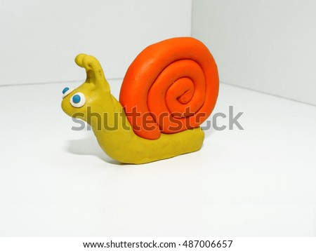 Yellow orange snail made from color plasticine