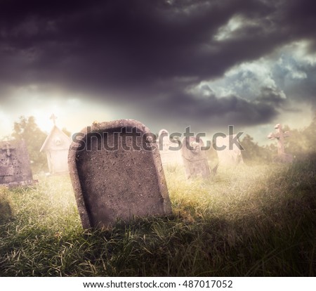 graveyard with fog and dramatic lighting