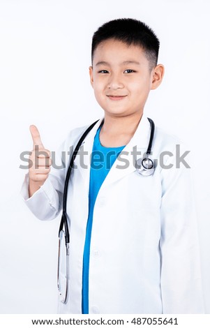 Asian Chinese boy pretending as doctor with stethoscope in plain white background.