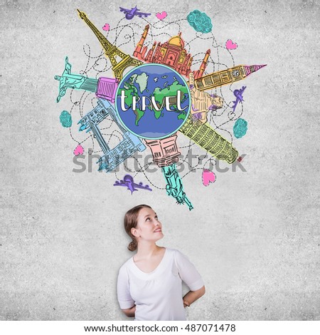 Pretty european girl looking at colorful traveling sketch on concrete wall background. Travel concept
