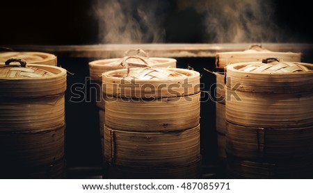 Dim sum steamers at a Chinese restaurant in Bangkok, Thailand Royalty-Free Stock Photo #487085971