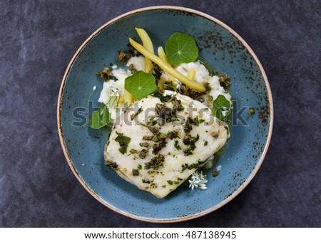 Butter poached halibut with french beans, celeriac mash and caper sauce