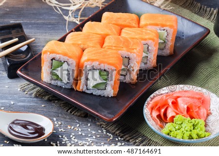 philadelphia roll with cucumber and cheese, salmon, still life close-up, eight pieces