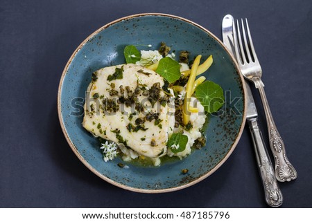 Butter poached halibut with french beans, celeriac mash and caper sauce