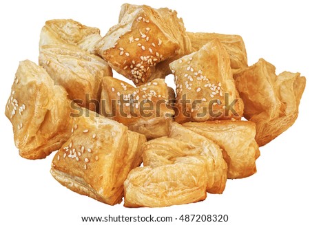 Bunch Of Freshly Baked Small Square Sesame Puff Pastry Zu-Zu Isolated On White Background