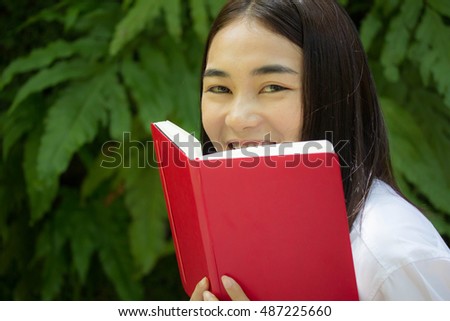 thai adult student university beautiful girl reading red book