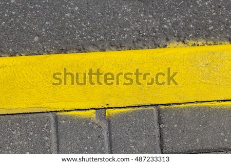   yellow markings on the curb line, which prohibits stopping and parking of vehicles
