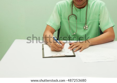 Doctor writing a medical prescription.