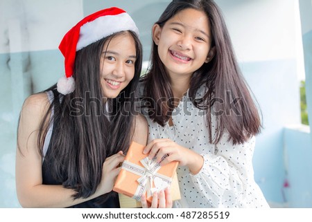 two asia thai teen beautiful girl happy new year and Give a Gift Friends