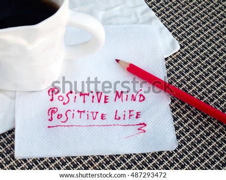 Positive mind - Positive life motivation slogan on tissue in coffee shop