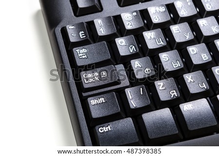 electronic collection - detail black computer  keyboard with russian letter with key tab, key caps, key shift  on white background 