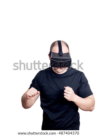 Man with virtual reality headset playing a sport fight video game isolated on white background. Entertainment and gaming technology concept.