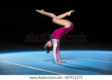 portrait of young gymnasts competing in the stadium, retouched