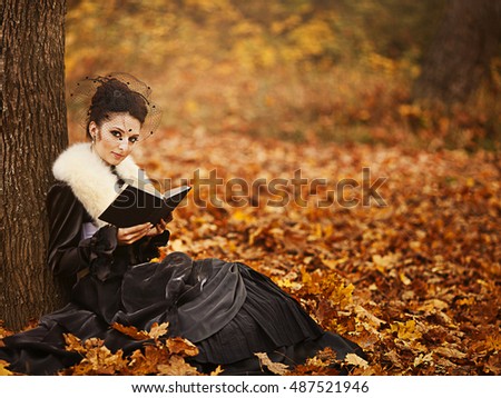 beautiful girl in a vintage dress in the autumn park. card