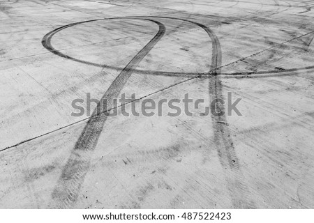 black tire tracks skid on road
