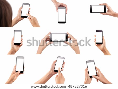 Set of female hands holding black modern cellphone with blank screen at isolated white background. Royalty-Free Stock Photo #487527316