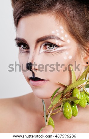 Young Woman Deer Animal. Face with Artistic Make-up