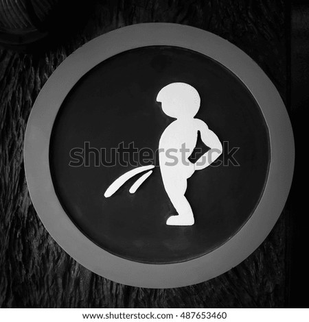 Toilets signs for public restroom on black background