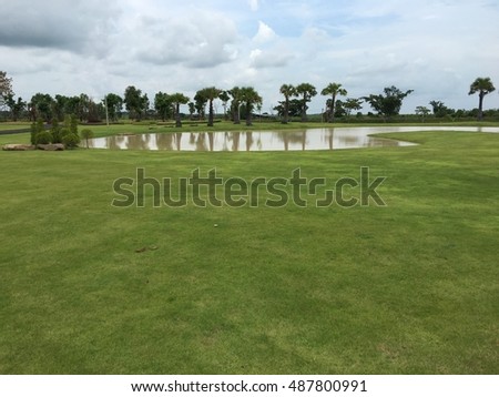 Green grass on a golf field Close up green grass field with blur park background,Spring and summer concept,vintage filter Royalty-Free Stock Photo #487800991