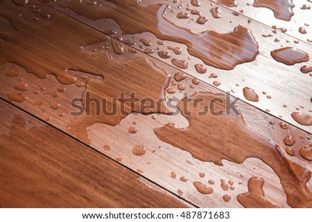 water drops on wooden board closeup