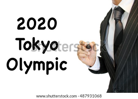 Tokyo Olympics written by a young businessman Royalty-Free Stock Photo #487931068